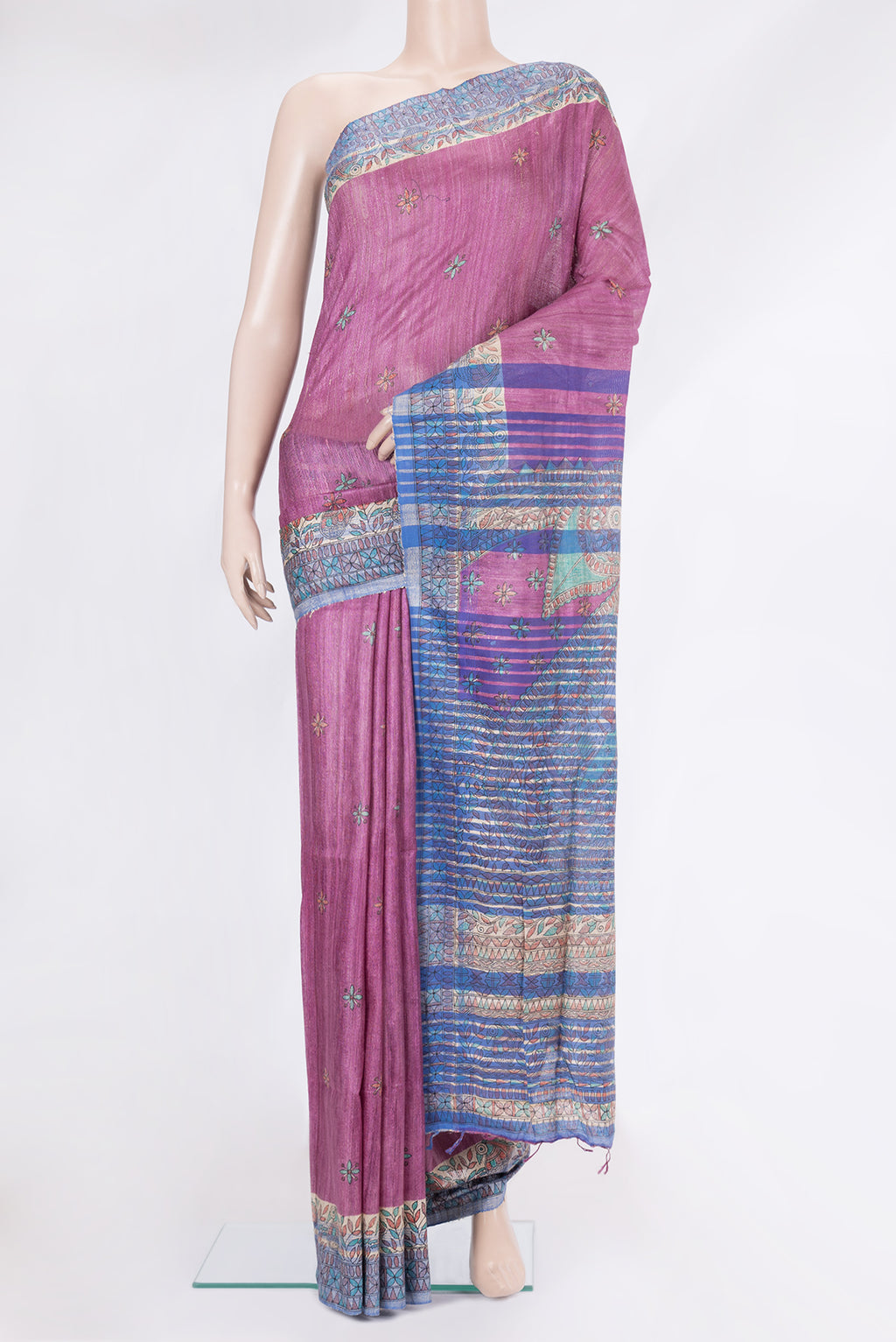 Magenta Tussar Silk Saree with Printed design on the body and Printed Border.  displayed on a mannequin