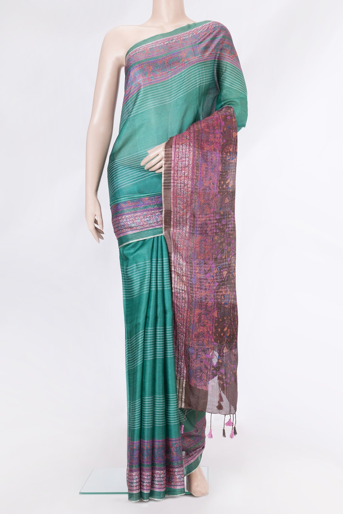 Green Tussar Silk Saree with Stripes on the body and Printed Border.  displayed on a mannequin