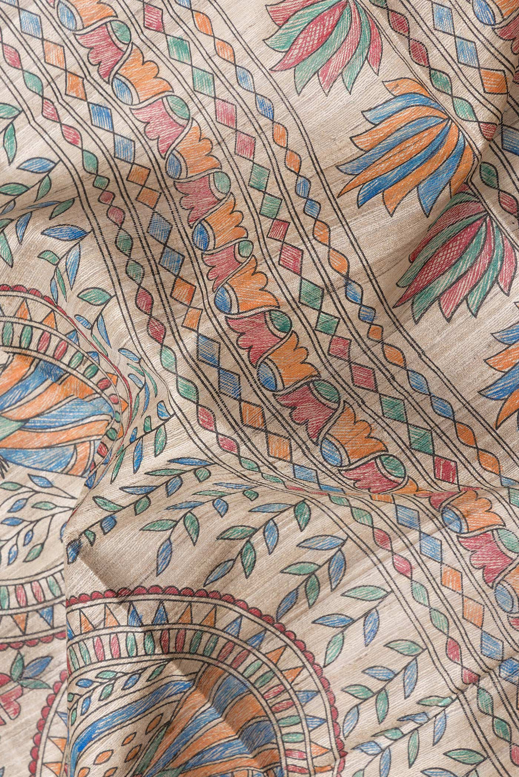Close up of Beige Dual Tone Tussar Silk Saree with Printed design on the body and Printed Border.  displaying folds