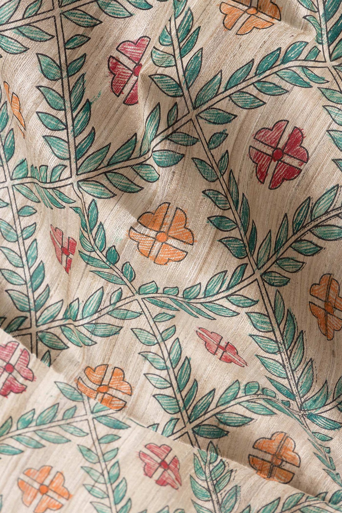 Close up of Beige Dual Tone Tussar Silk Saree with Printed design on the body and Printed Border.  displaying folds