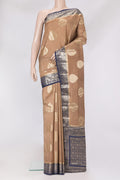 Beige Dual Tone Tussar Silk Saree with Zari Butta on the body and Zari Border.  displayed on a mannequin