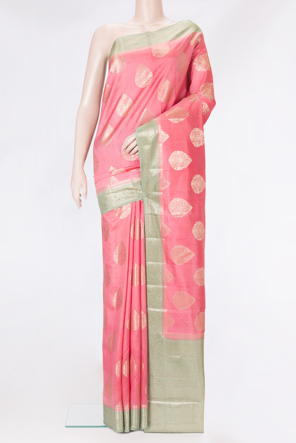 Pink Tussar Silk Saree with Zari Butta on the body and Zari Border.  displayed on a mannequin