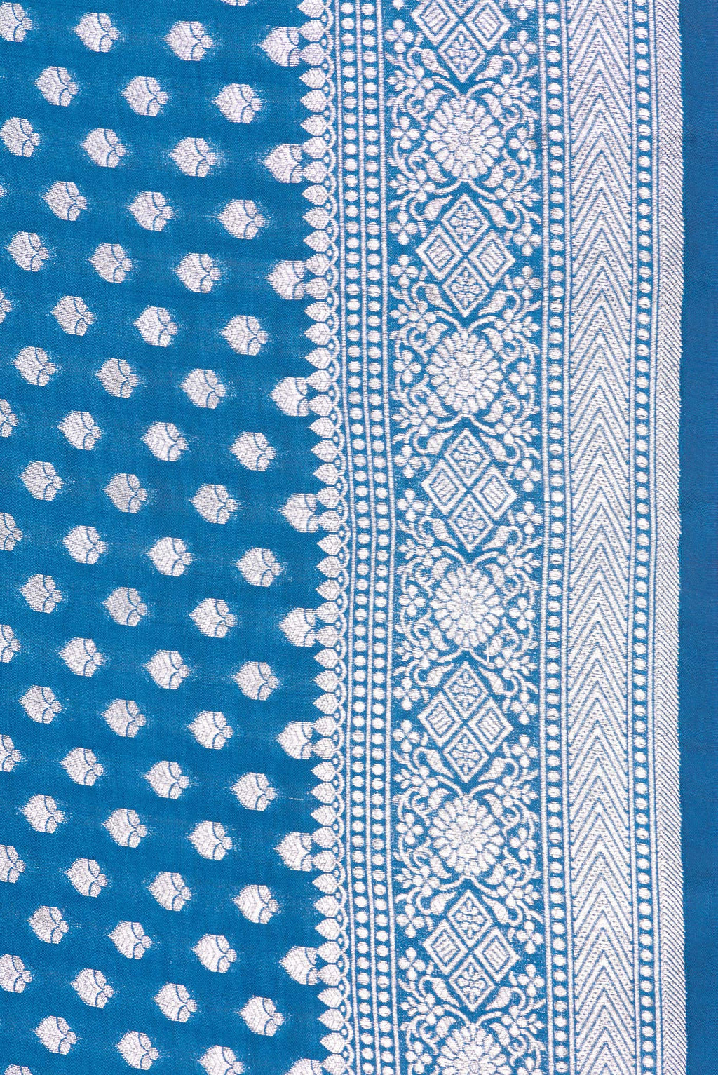 Border image of Peacock Blue Dual Tone Tussar Silk Saree with Zari Butta on the body and Zari Border. 