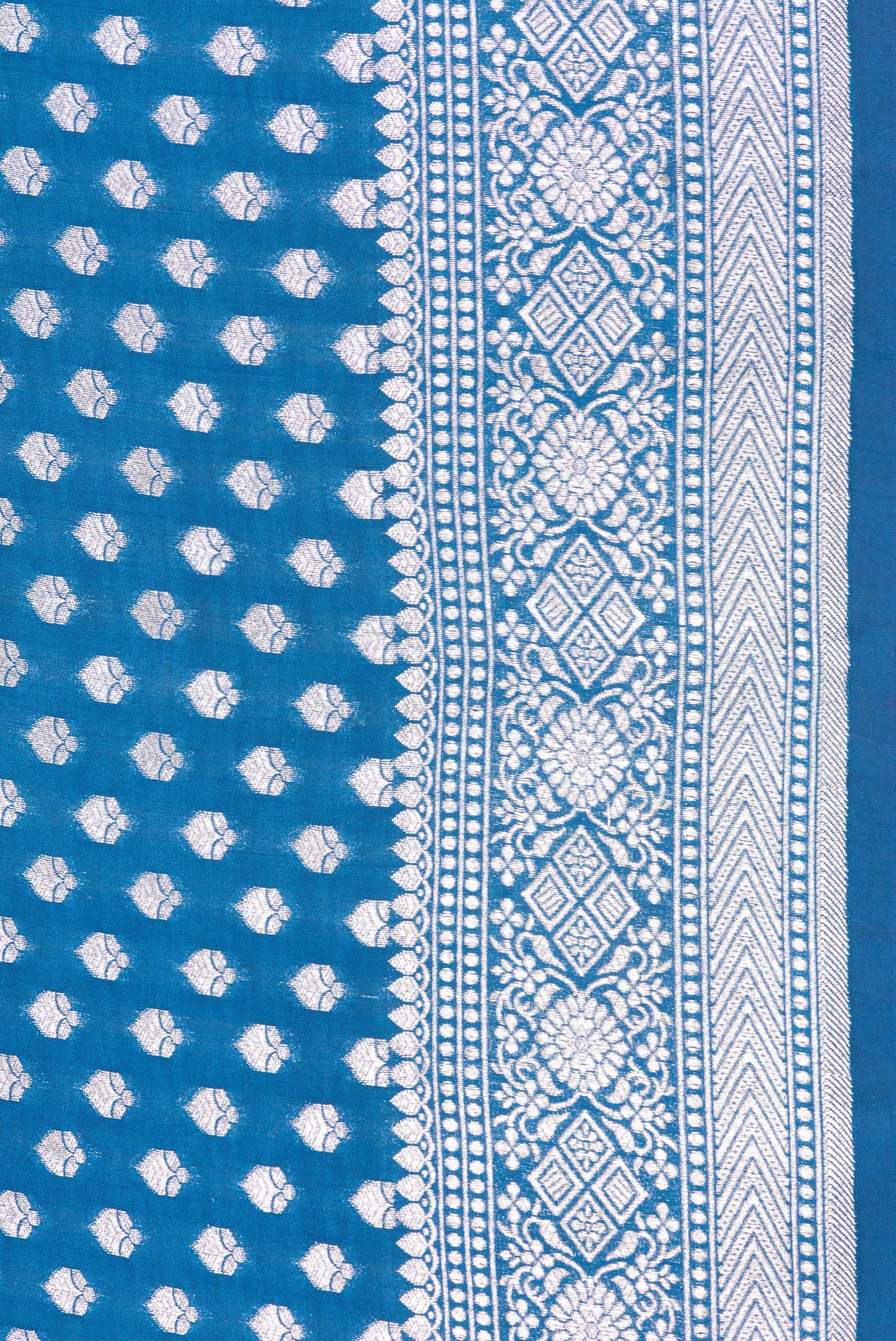Border image of Peacock Blue Dual Tone Tussar Silk Saree with Zari Butta on the body and Zari Border. 