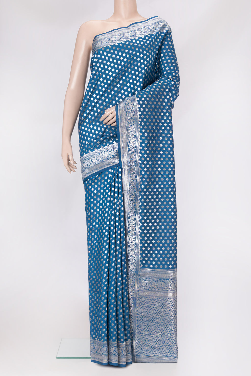 Peacock Blue Dual Tone Tussar Silk Saree with Zari Butta on the body and Zari Border.  displayed on a mannequin