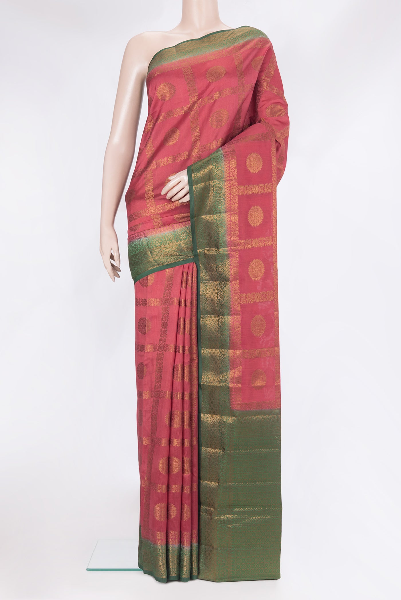 Maroon Tussar Silk Saree with Zari Butta on the body and Zari Border.  displayed on a mannequin