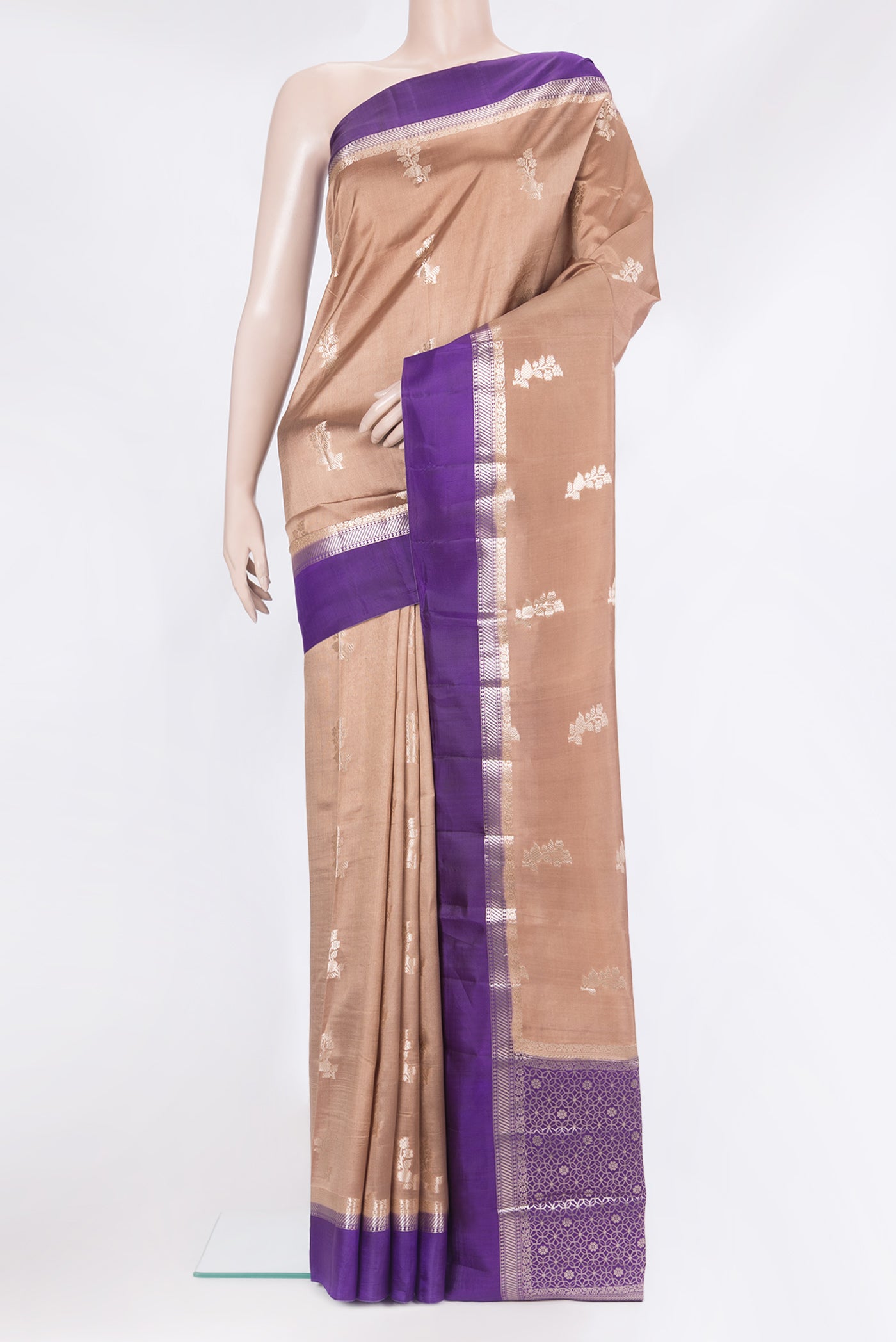 Brown Tussar Silk Saree with Zari Butta on the body and Zari Border.  displayed on a mannequin