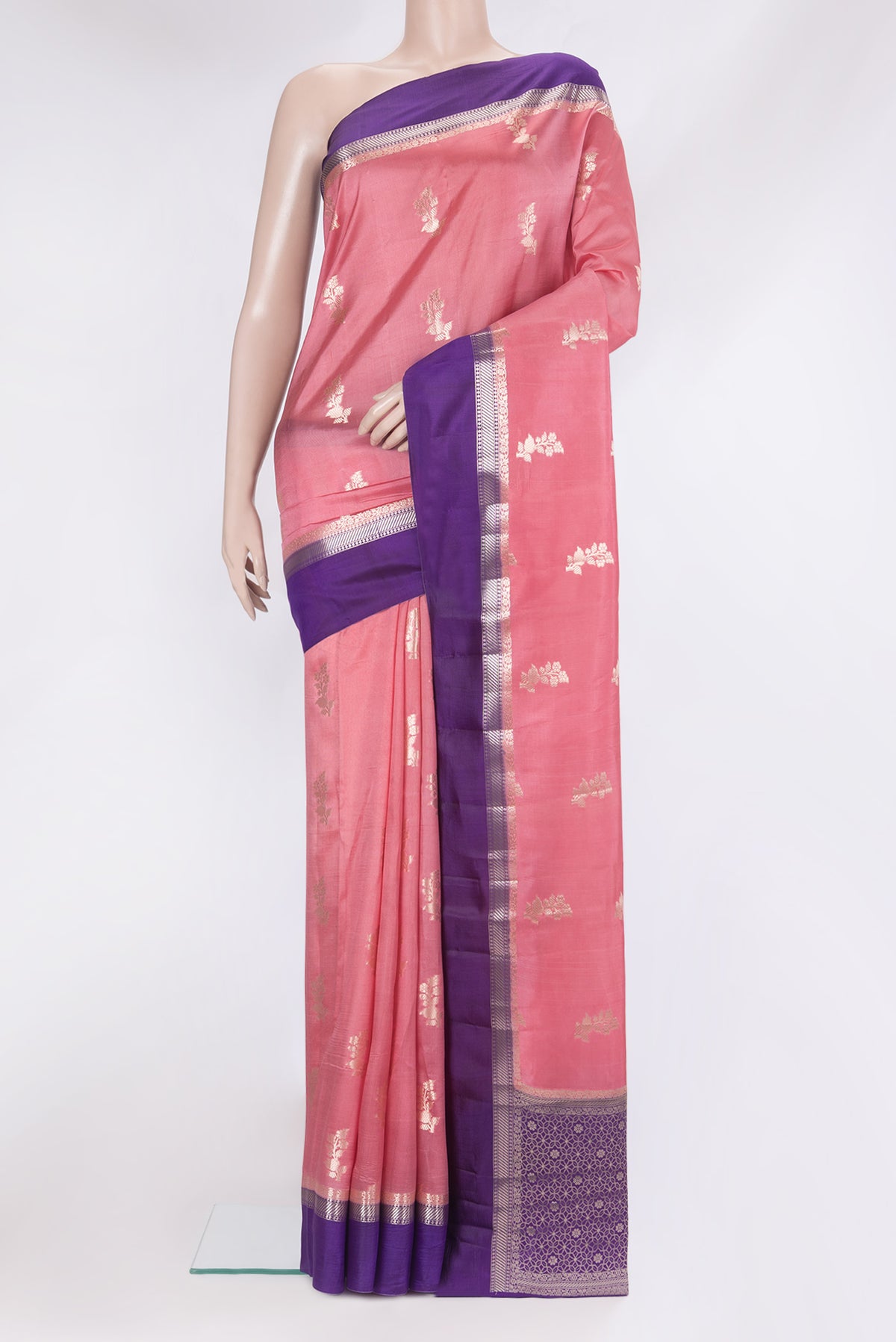 Pink Tussar Silk Saree with Zari Butta on the body and Zari Border.  displayed on a mannequin