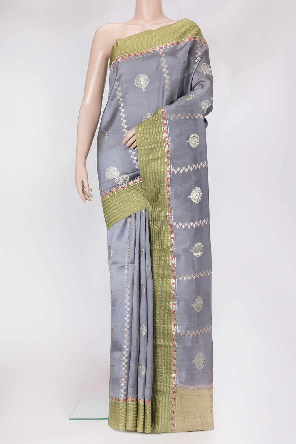 Grey Dual Tone Tussar Silk Saree with Zari Butta on the body and Fancy Border.  displayed on a mannequin