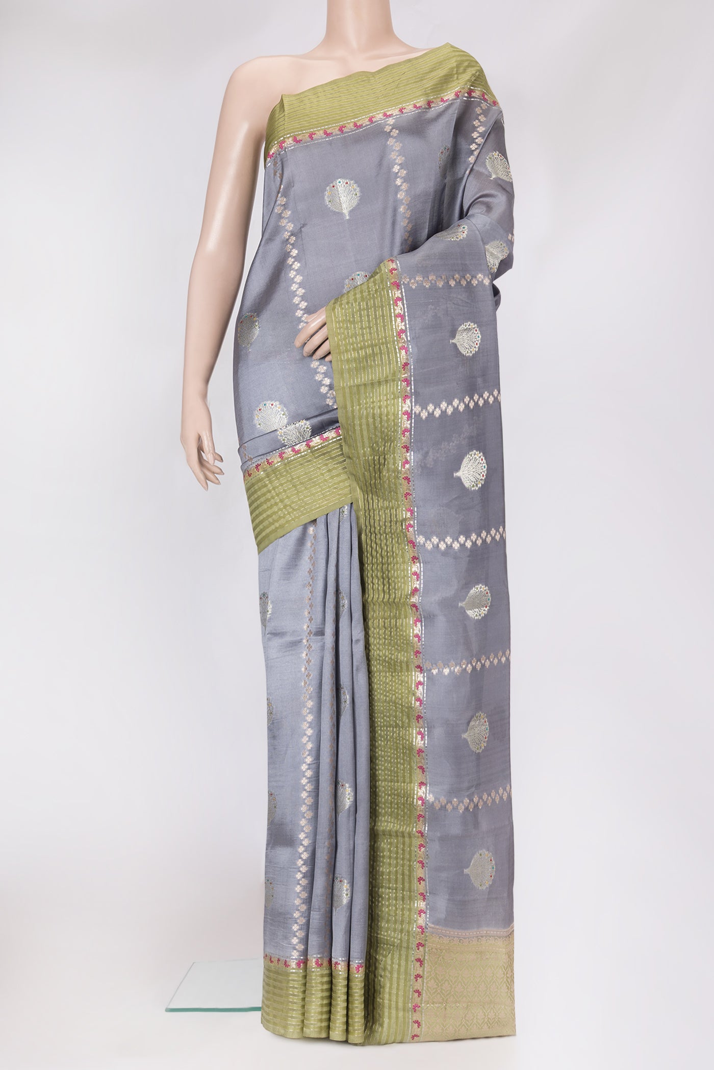 Grey Dual Tone Tussar Silk Saree with Zari Butta on the body and Fancy Border.  displayed on a mannequin
