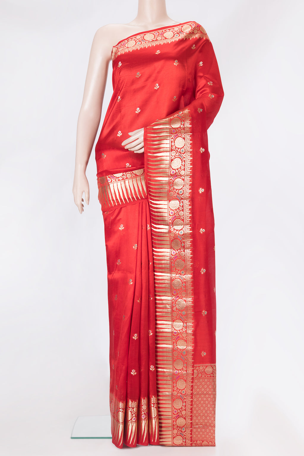 Red Tussar Silk Saree with Zari Butta on the body and Zari Border.  displayed on a mannequin