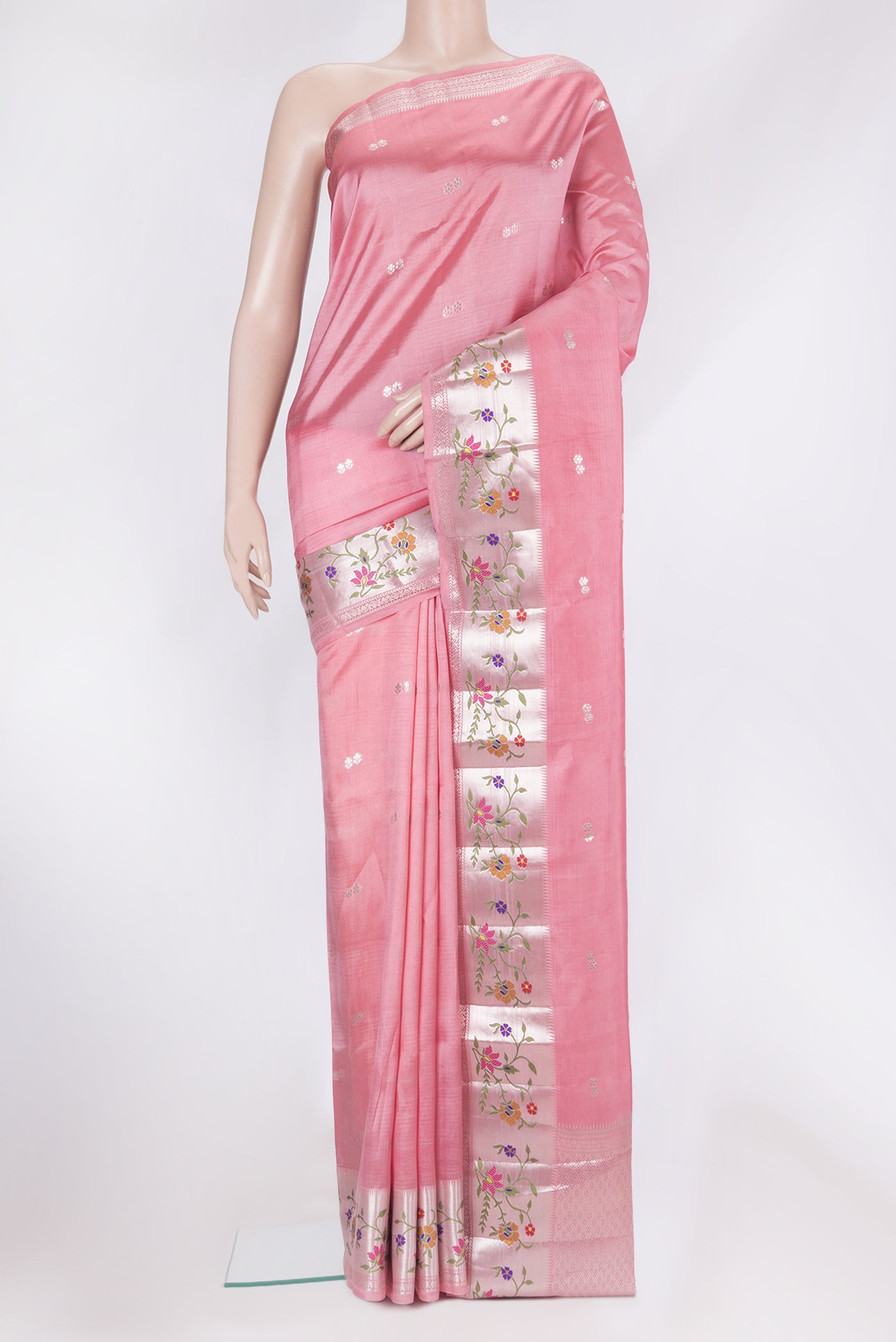 Pink Tussar Silk Saree with Zari Butta on the body and Fancy Border.  displayed on a mannequin
