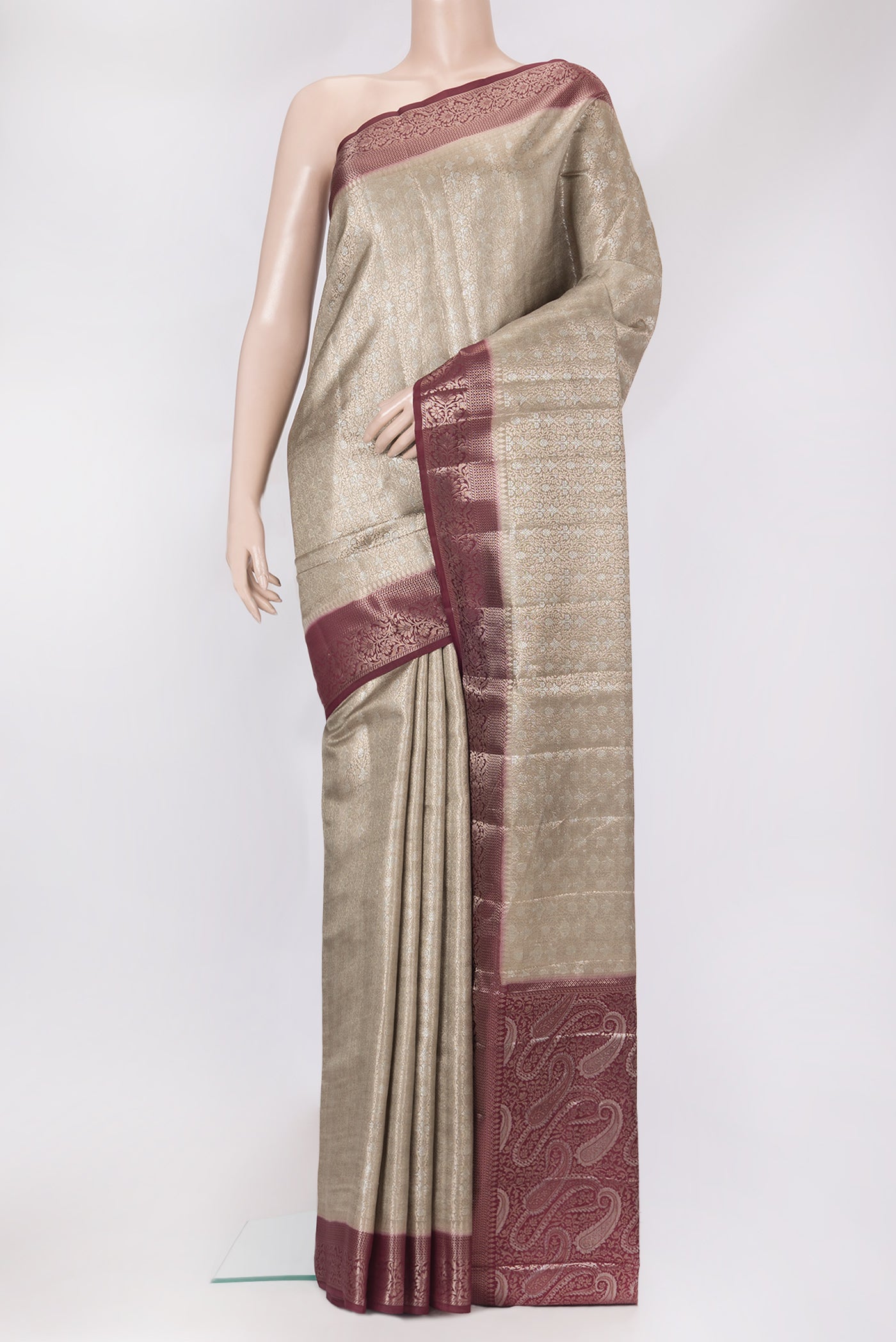 Beige Dual Tone Tussar Silk Saree with Zari Brocade on the body and Zari Border.  displayed on a mannequin
