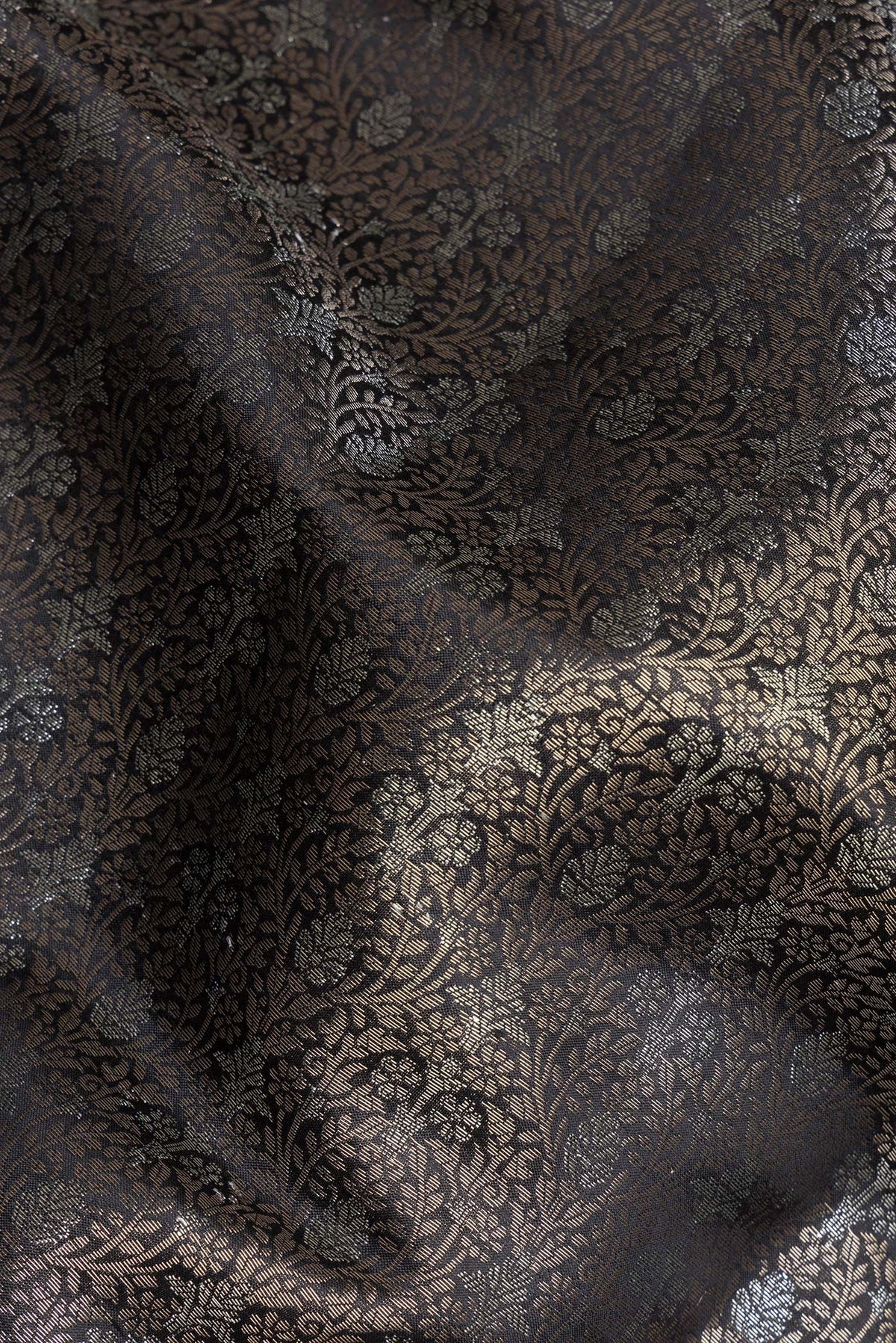 Close up of Pure Silk Brown Dual Tone Tussar Saree with Zari Brocade on the body and Fancy Border.  displaying folds