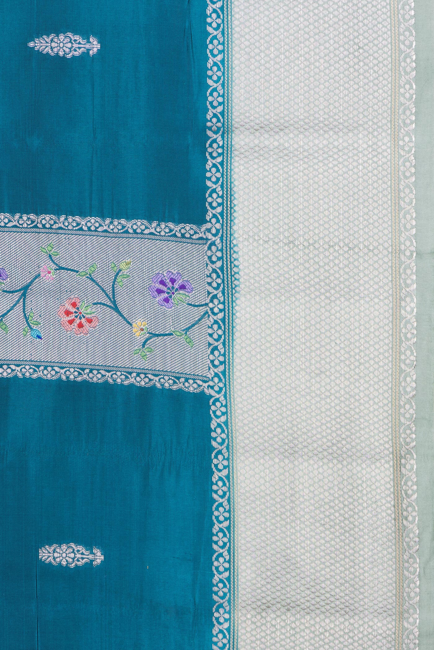 Border image of Peacock Blue Dual Tone Tussar Silk Saree with Zari Butta on the body and Zari Border. 
