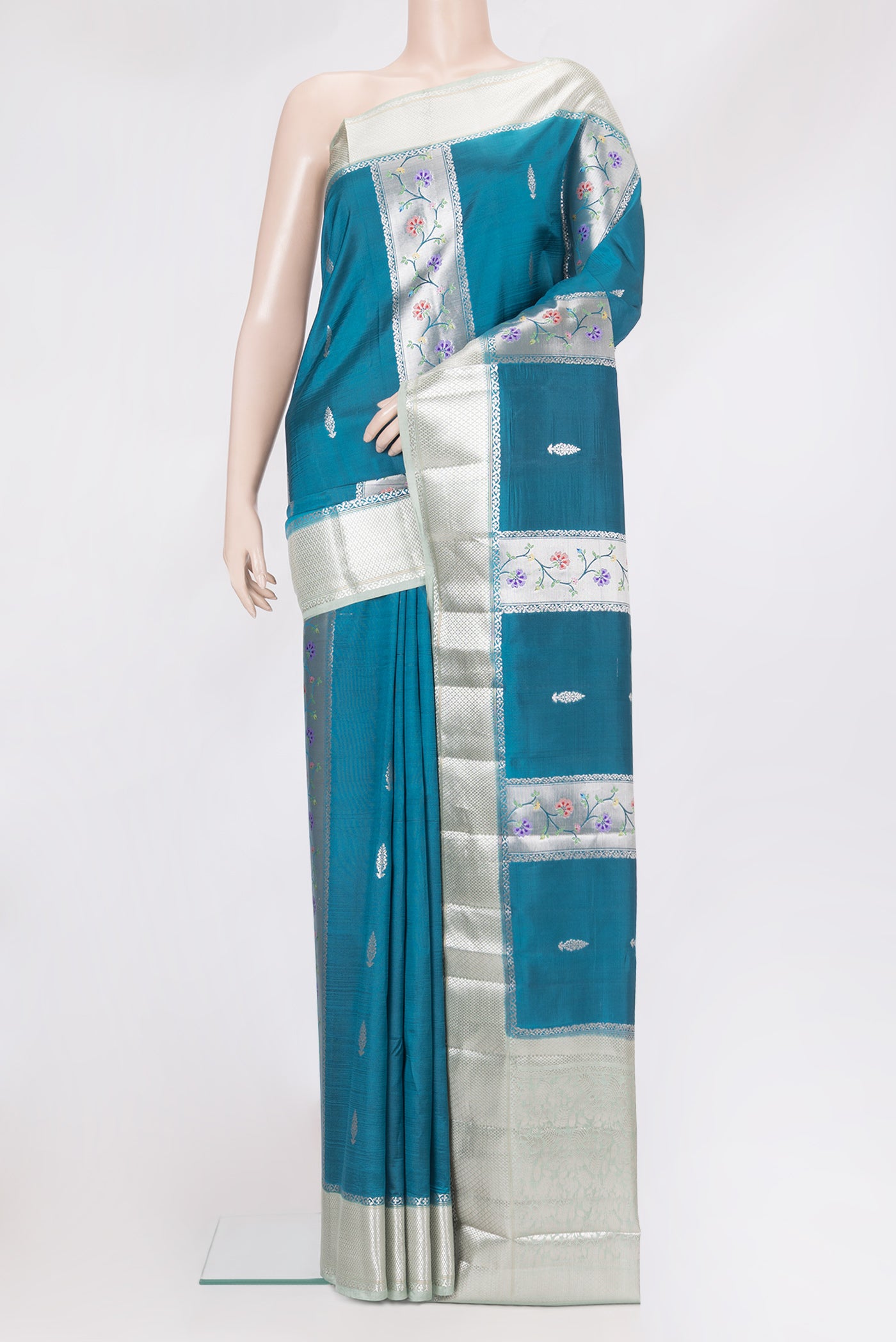 Peacock Blue Dual Tone Tussar Silk Saree with Zari Butta on the body and Zari Border.  displayed on a mannequin