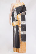 Black Dual Tone Tussar Silk Saree with Zari Butta on the body and Zari Border.  displayed on a mannequin
