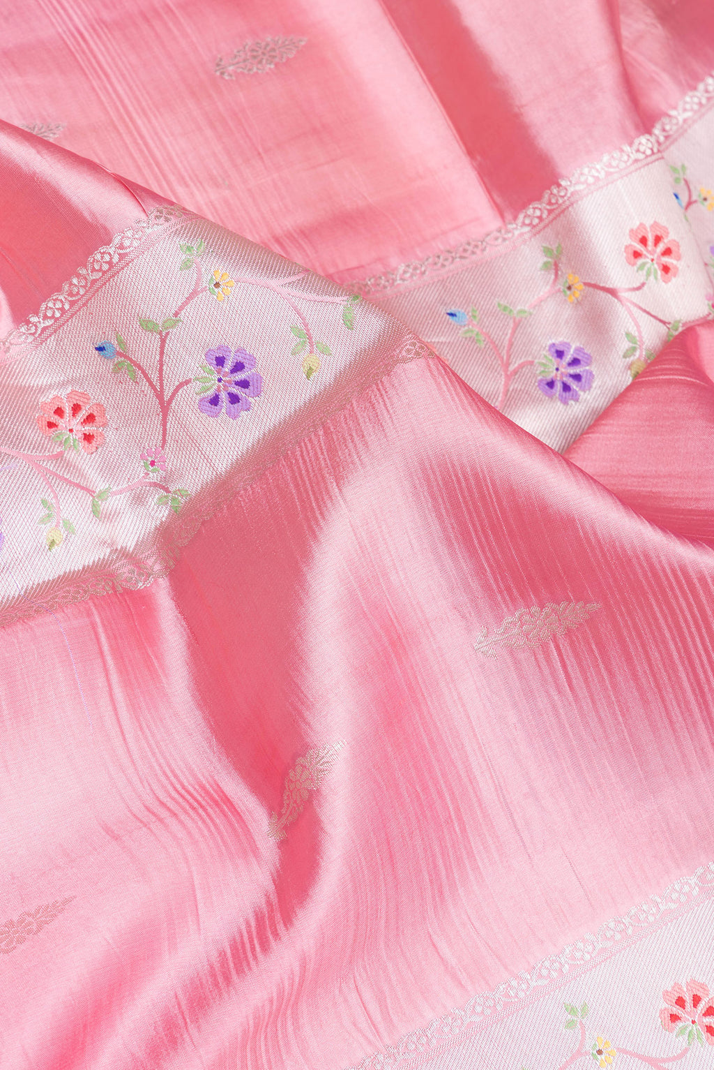 Close up of Pink Dual Tone Tussar Silk Saree with Zari Butta on the body and Zari Border.  displaying folds