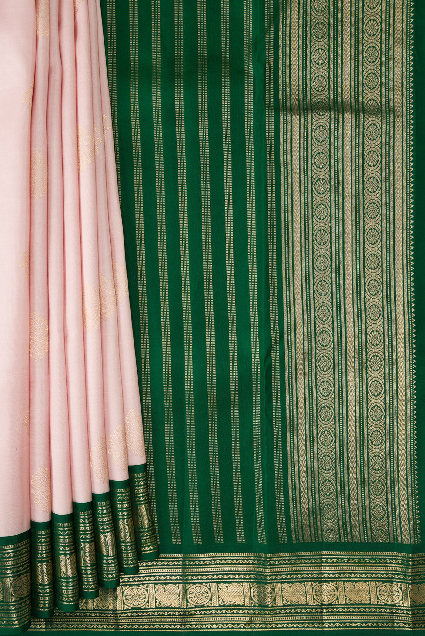 Pleats and pallu of Rose Gold Dual Tone Kanchipuram Silk Saree with Zari Butta on the body and Zari Border. 