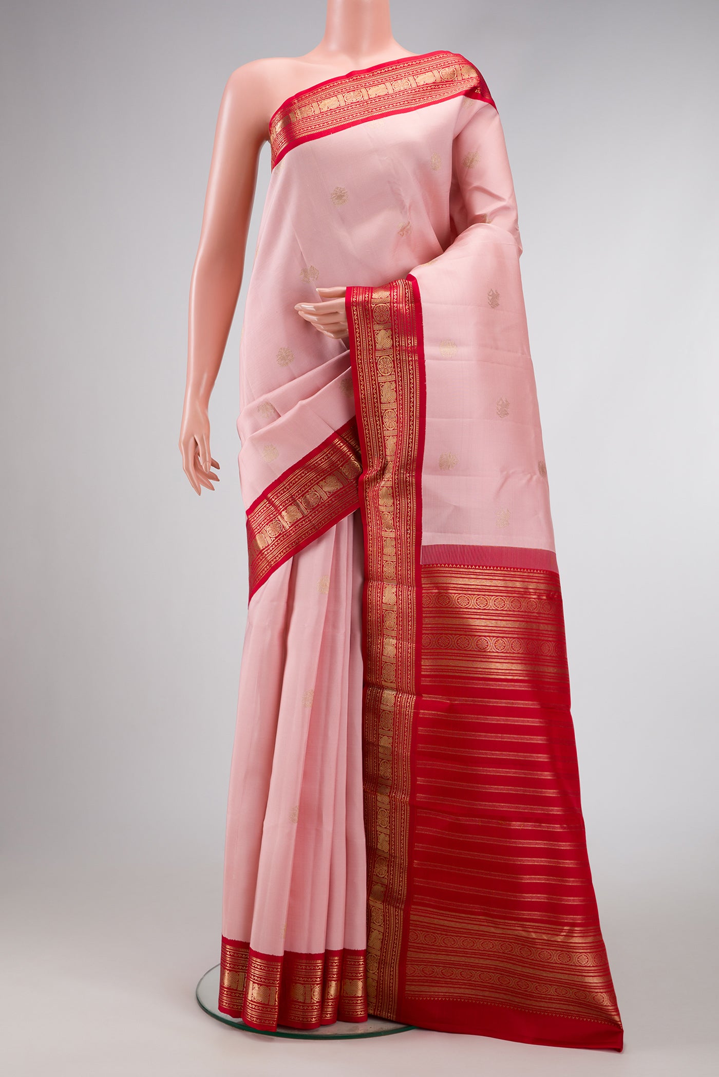 Pink Dual Tone Kanchipuram Silk Saree with Zari Butta on the body and Zari Border.  displayed on a mannequin