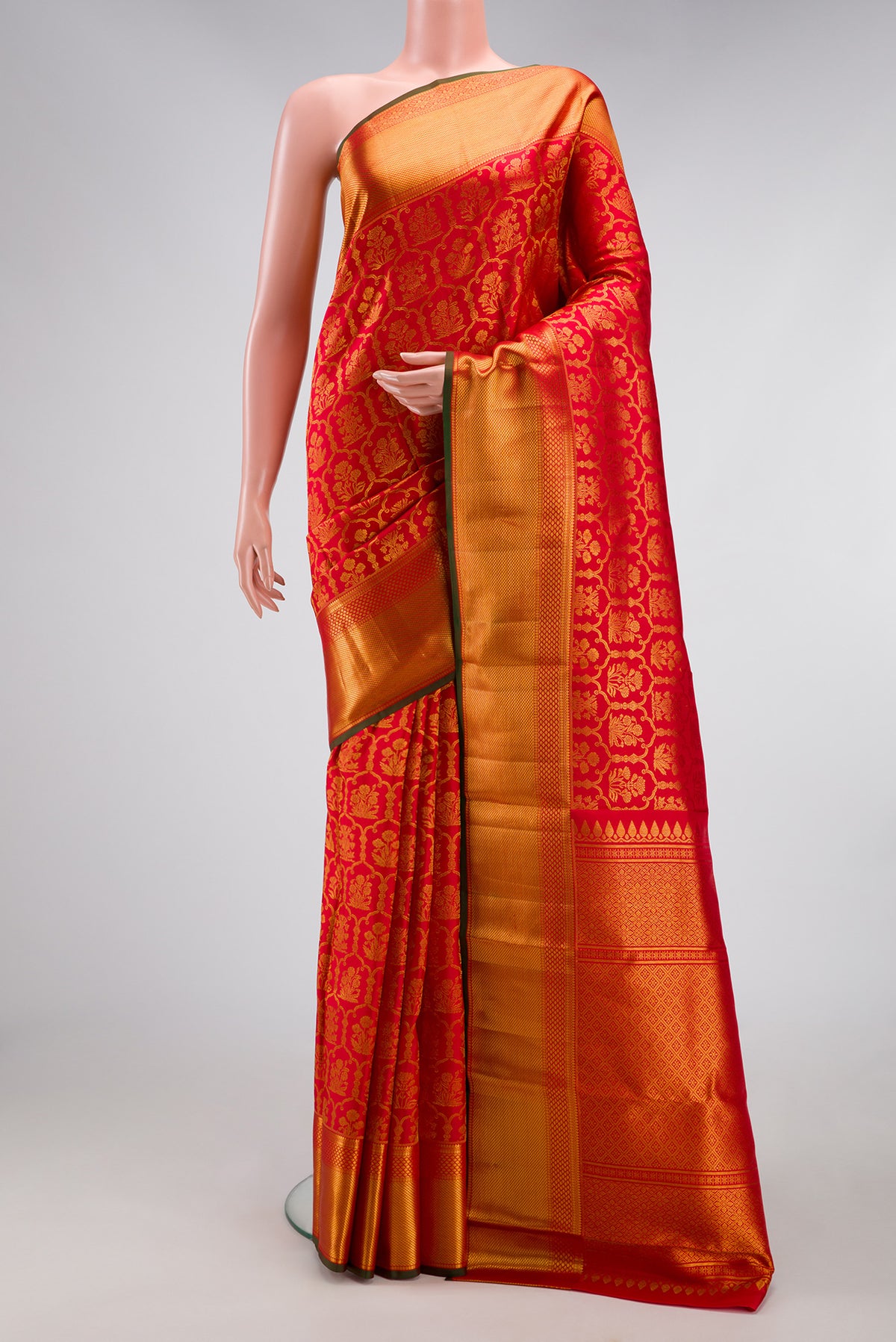 Red Kanchipuram Silk Saree with Zari Brocade on the body and Zari Border.  displayed on a mannequin