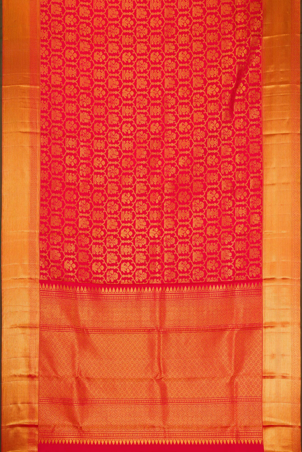 Flat view of Red Kanchipuram Silk Saree with Zari Brocade on the body and Zari Border. 
