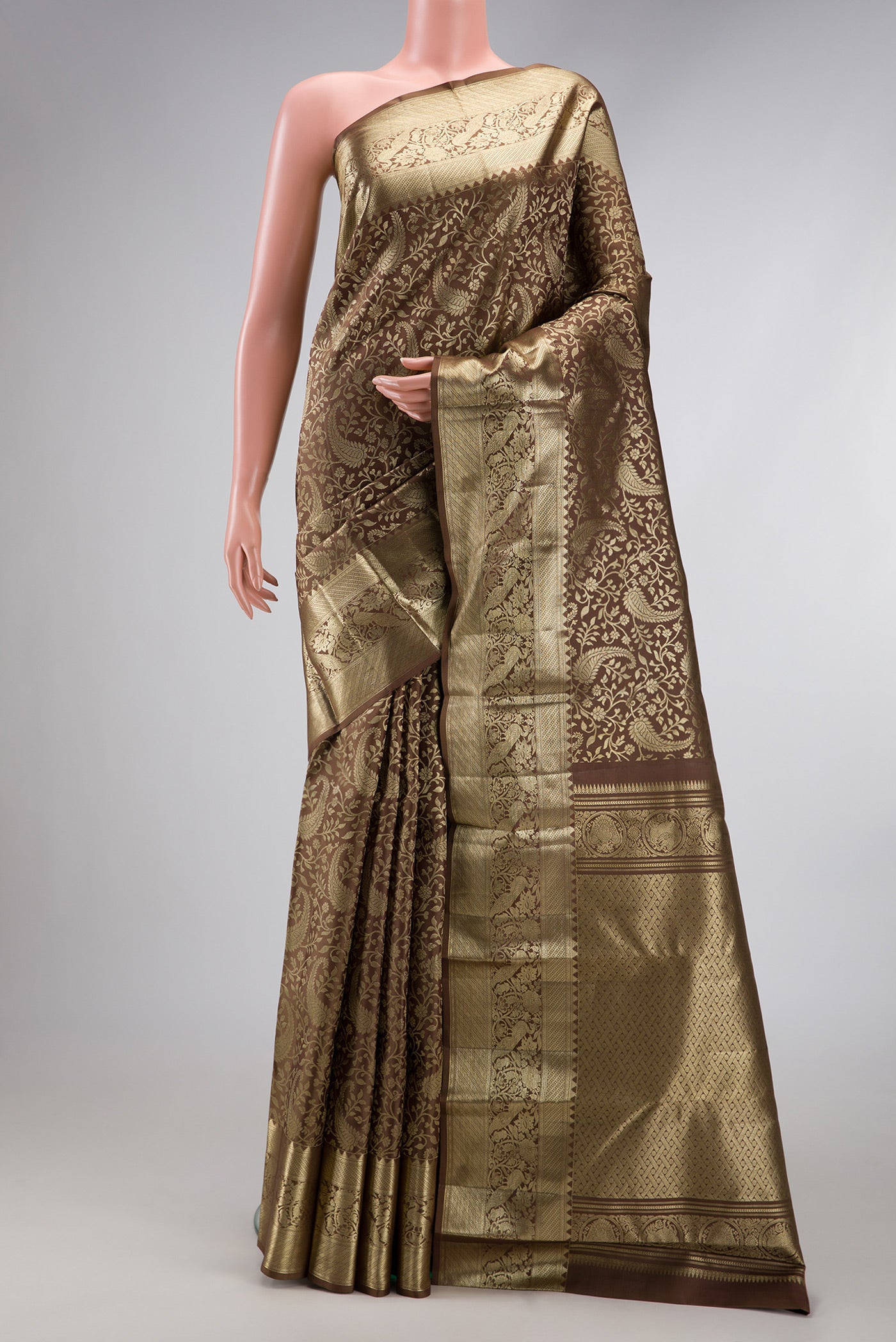 Brown Dual Tone Kanchipuram Silk Saree with Zari Brocade on the body and Zari Border.  displayed on a mannequin