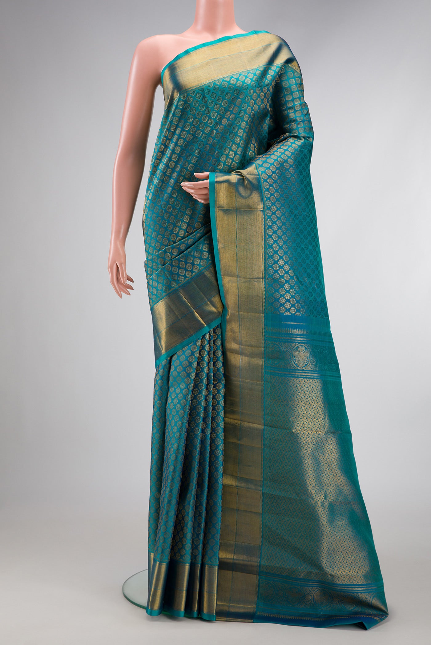 Peacock Blue Dual Tone Kanchipuram Silk Saree with Zari Brocade on the body and Zari Border.  displayed on a mannequin