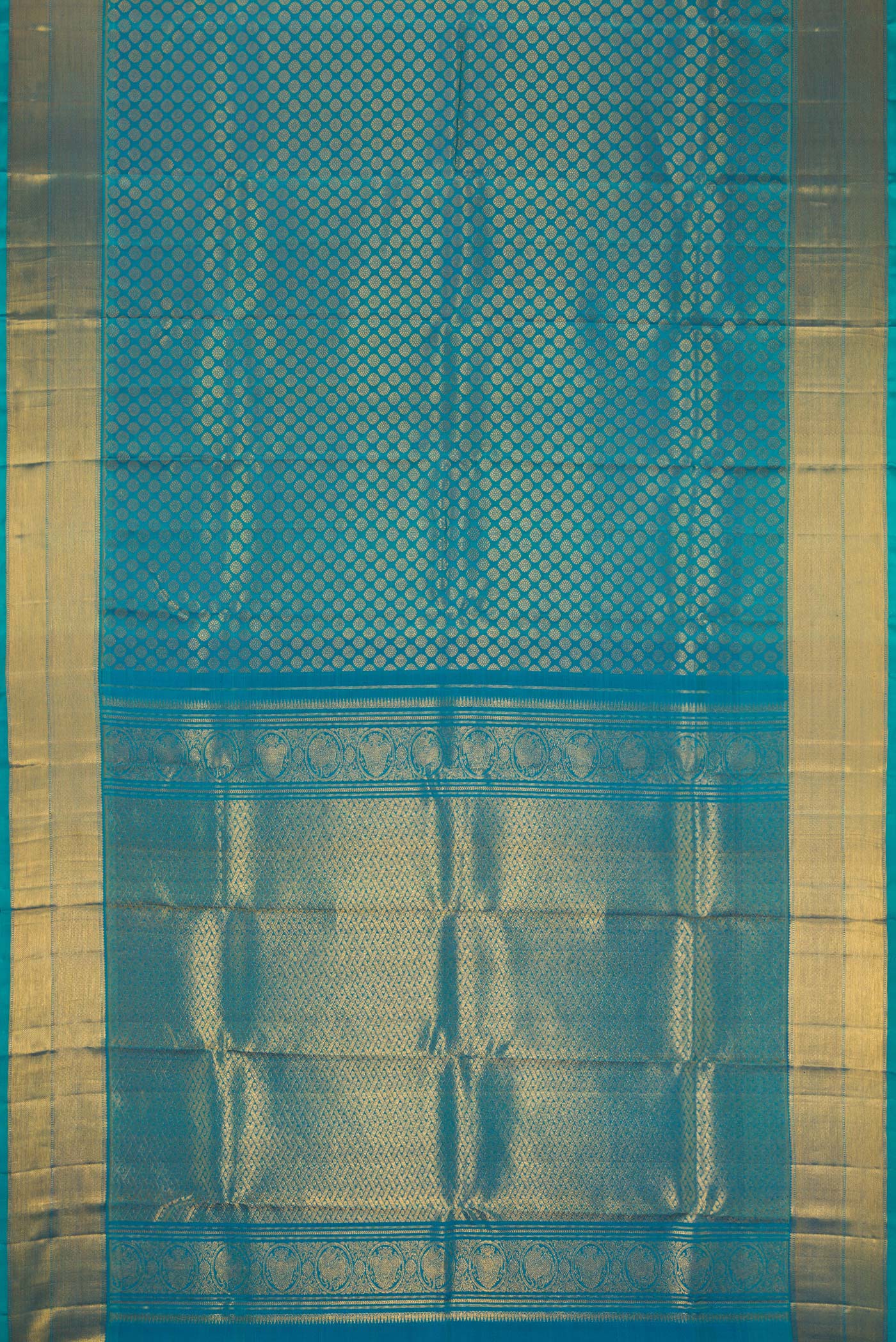 Flat view of Peacock Blue Dual Tone Kanchipuram Silk Saree with Zari Brocade on the body and Zari Border. 