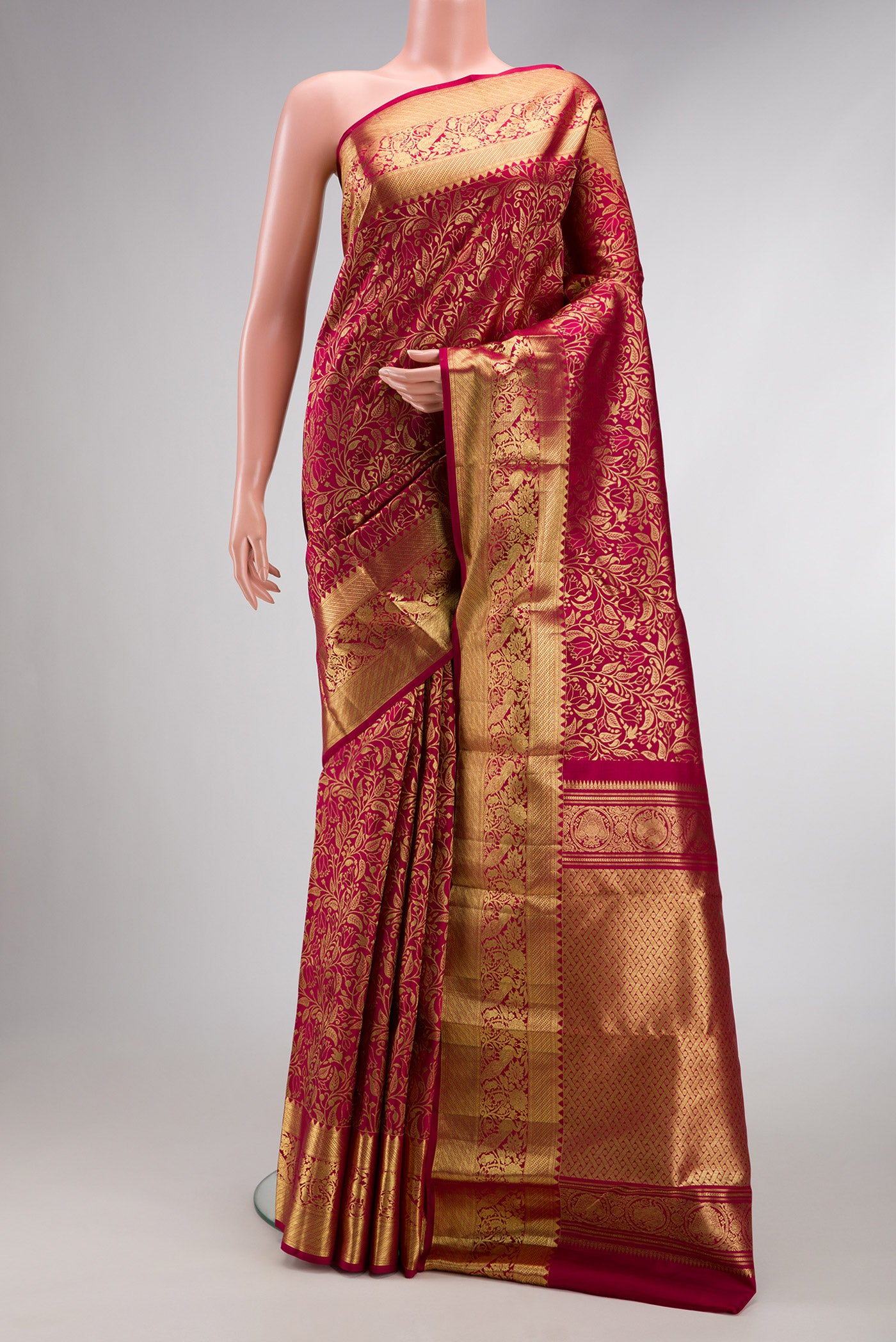 Dark Pink Dual Tone Kanchipuram Silk Saree with Zari Brocade on the body and Zari Border.  displayed on a mannequin