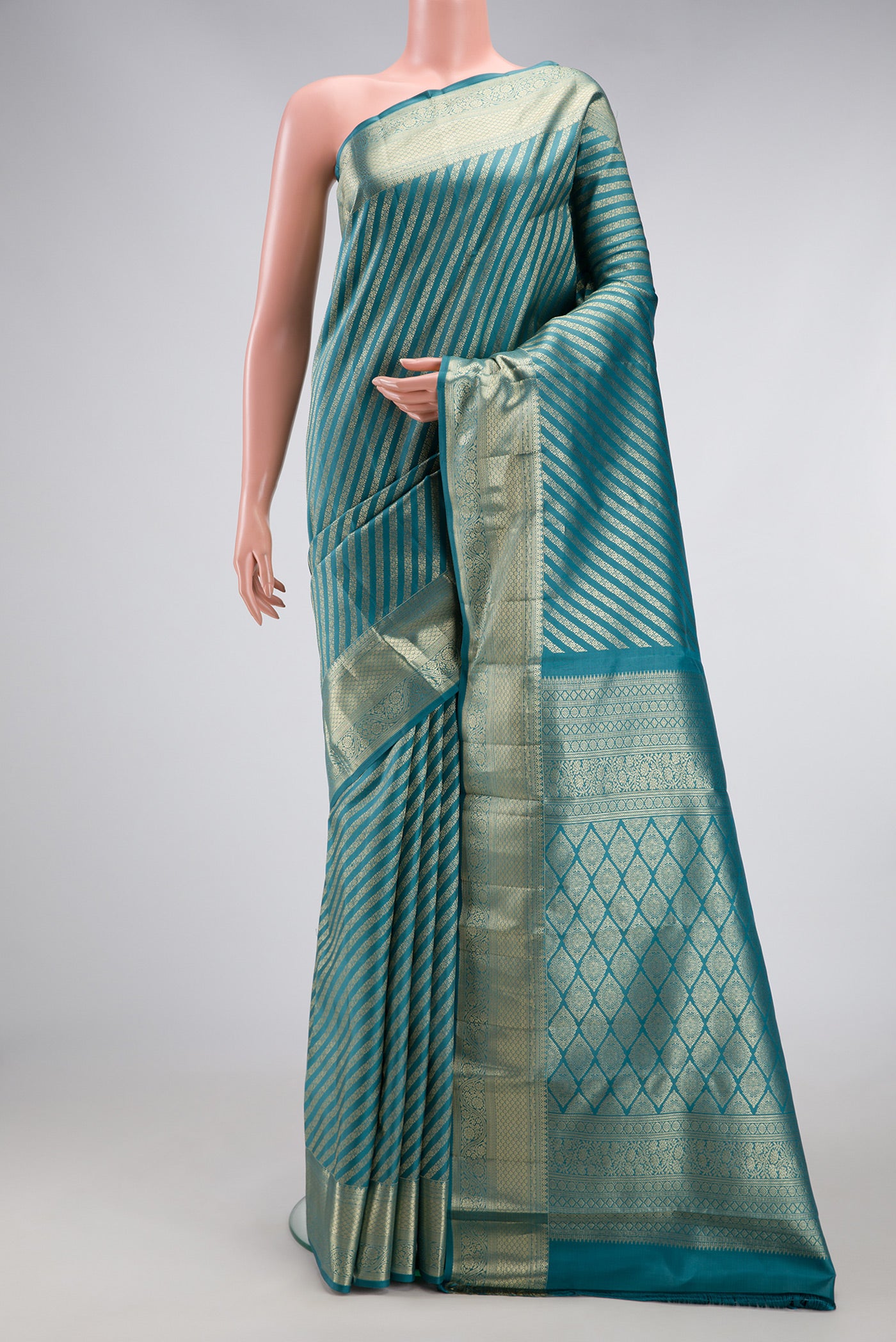 Maya Blue Kanchipuram Silk Saree with Zari Brocade on the body and Zari Border.  displayed on a mannequin