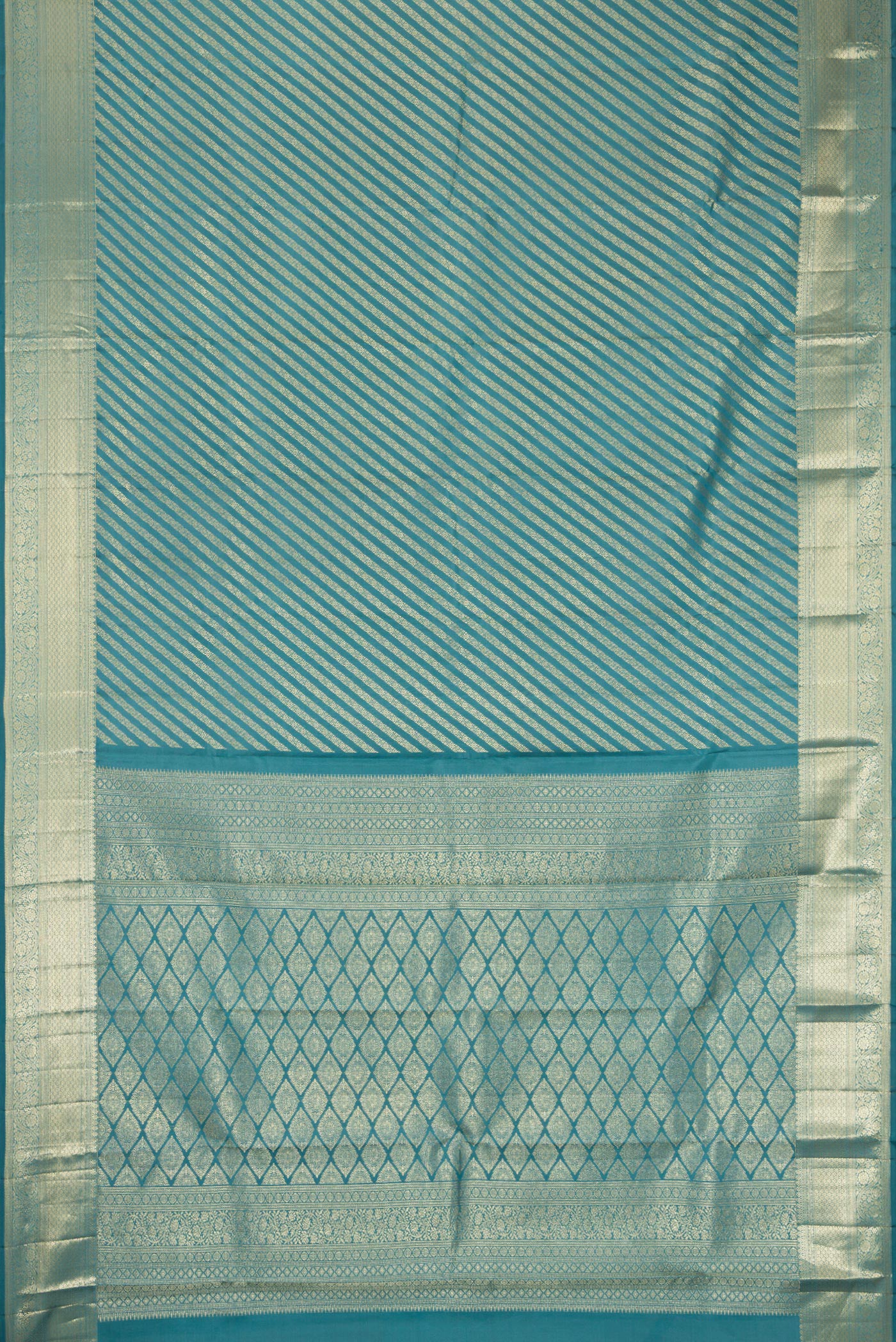 Flat view of Maya Blue Kanchipuram Silk Saree with Zari Brocade on the body and Zari Border. 