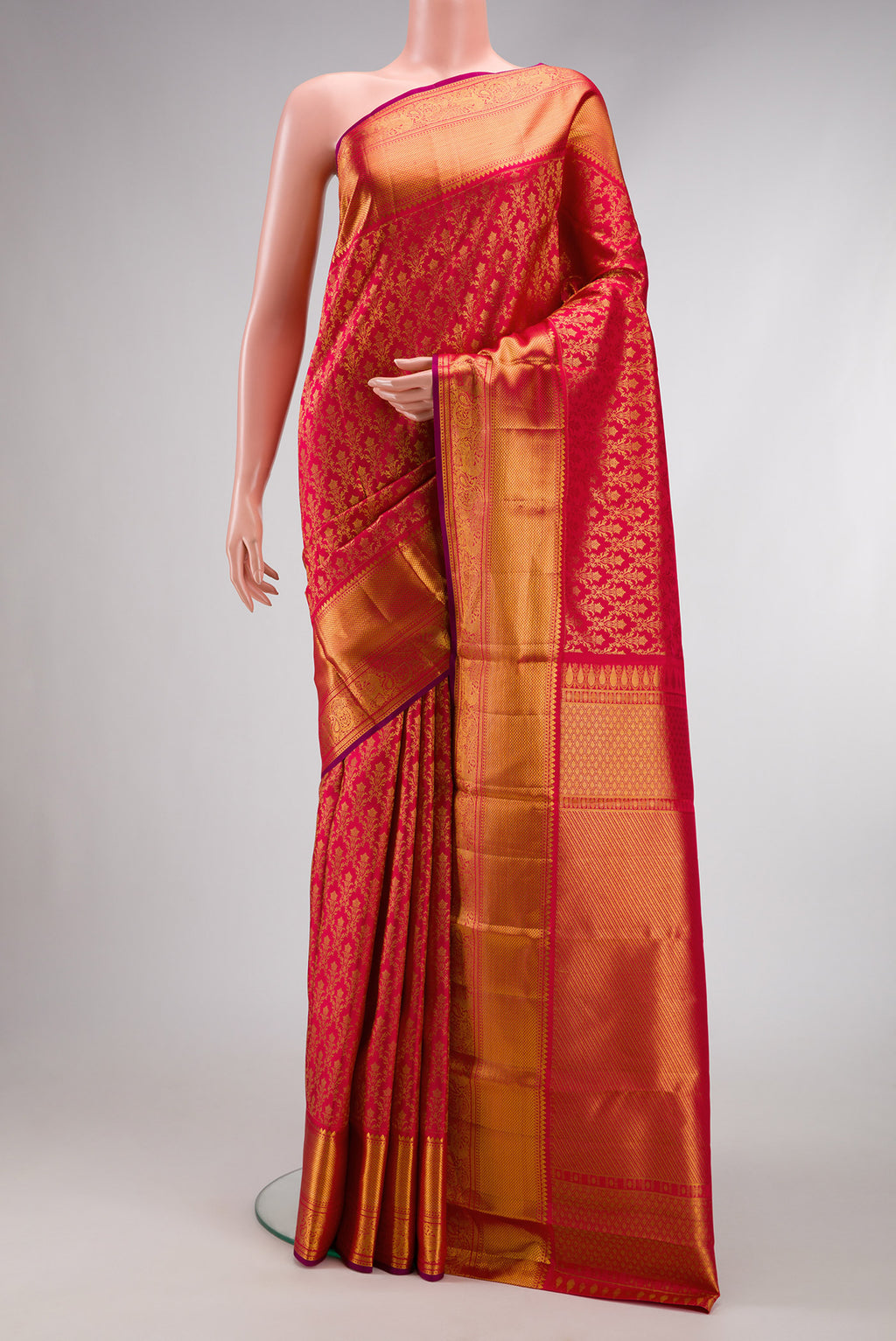 Dark Pink Dual Tone Kanchipuram Silk Saree with Zari Brocade on the body and Zari Border.  displayed on a mannequin
