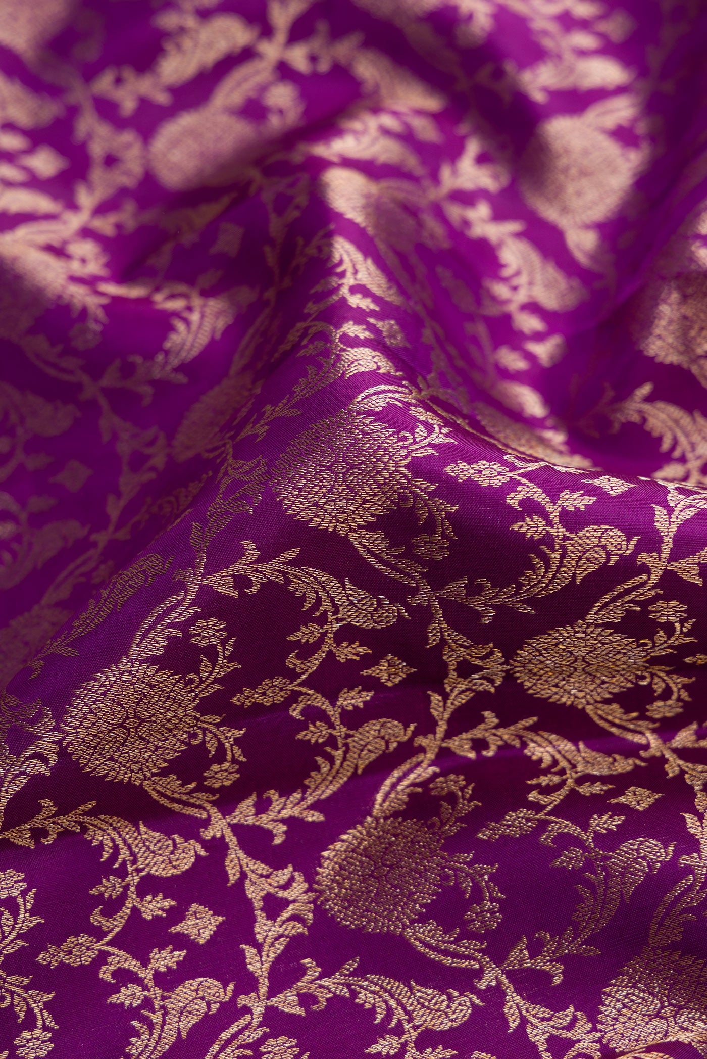 Close up of Royal Blue Dual Tone Kanchipuram Silk Saree with Zari Brocade on the body and Zari Border.  displaying folds