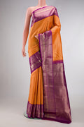 Orange Dual Tone Kanchipuram Silk Saree with Zari Brocade on the body and Zari Border.  displayed on a mannequin