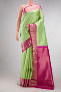 Parrot Green Dual Tone Kanjivaram Silk Saree with Zari Brocade on the body and Zari Border.  displayed on a mannequin