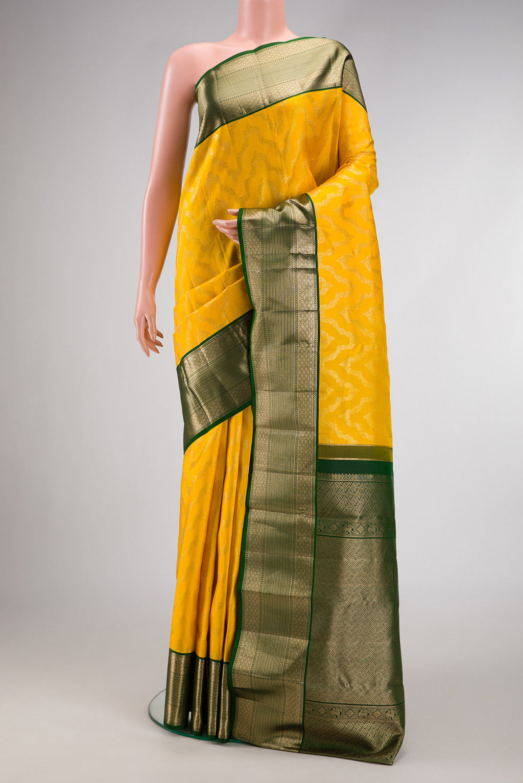 Yellow Dual Tone Kanjivaram Silk Saree with Zari Brocade on the body and Zari Border.  displayed on a mannequin
