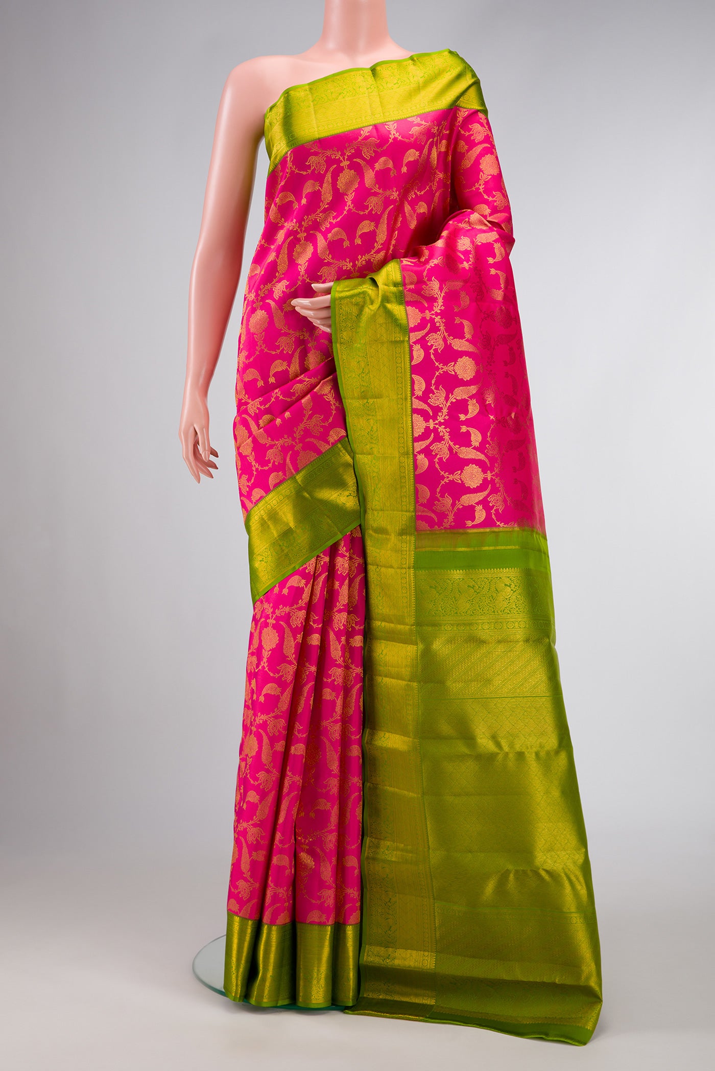 Pink Dual Tone Kanjivaram Silk Saree with Zari Brocade on the body and Zari Border.  displayed on a mannequin