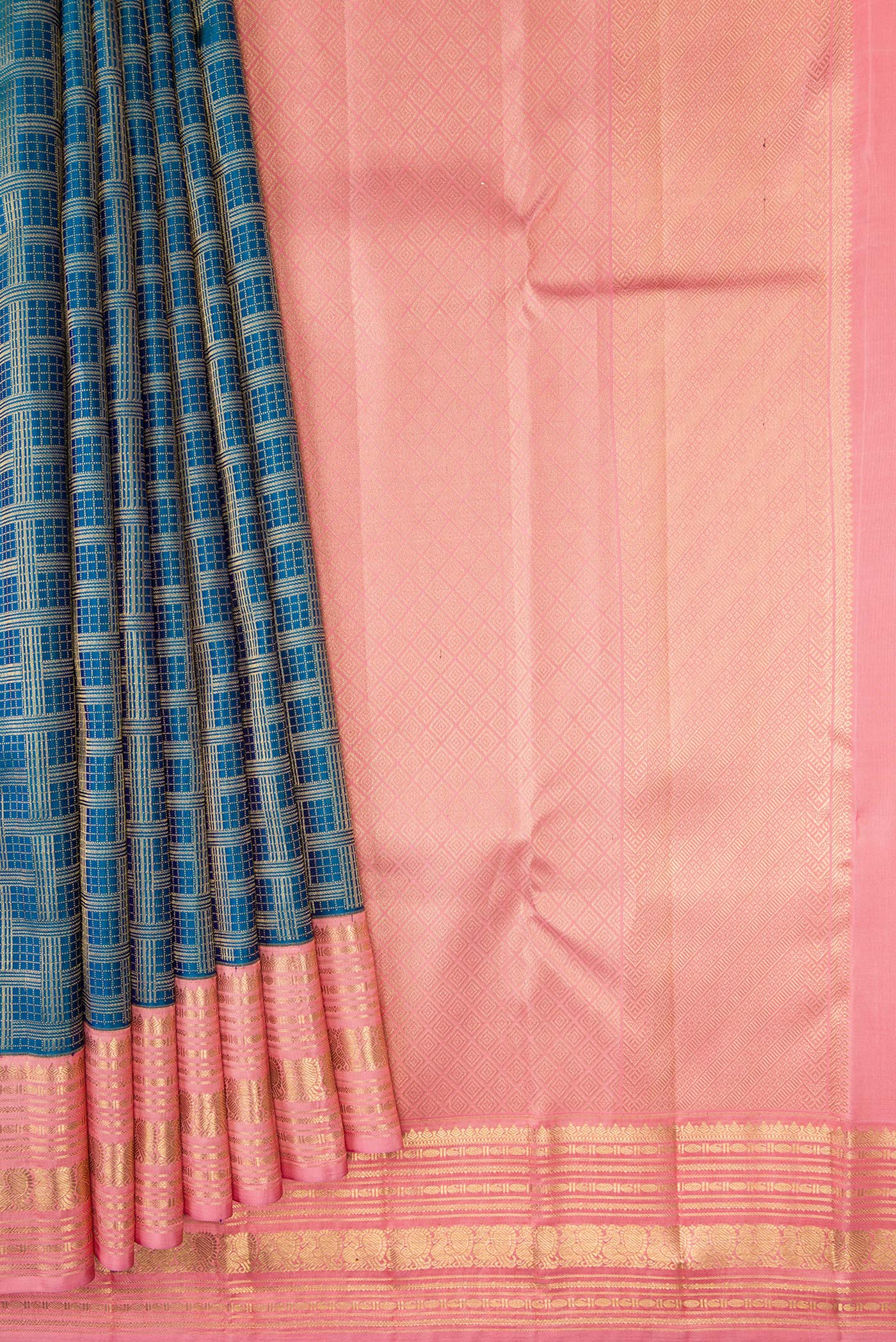 Pleats and pallu of Peacock Blue Dual Tone Kanjivaram Silk Saree with Zari Brocade on the body and Zari Border. 
