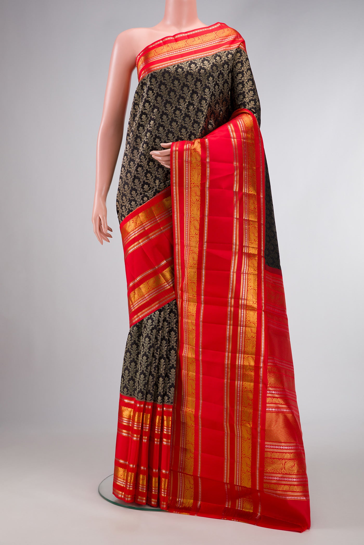 Black Dual Tone Kanjivaram Silk Saree with Zari Brocade on the body and Zari Border.  displayed on a mannequin