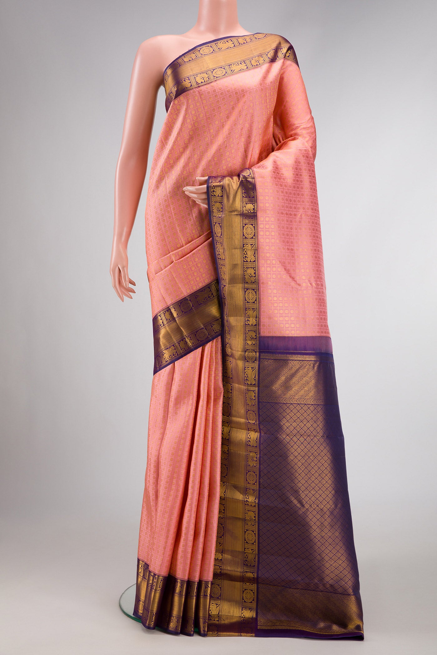 Pink Dual Tone Kanjivaram Silk Saree with Zari Brocade on the body and Zari Border.  displayed on a mannequin