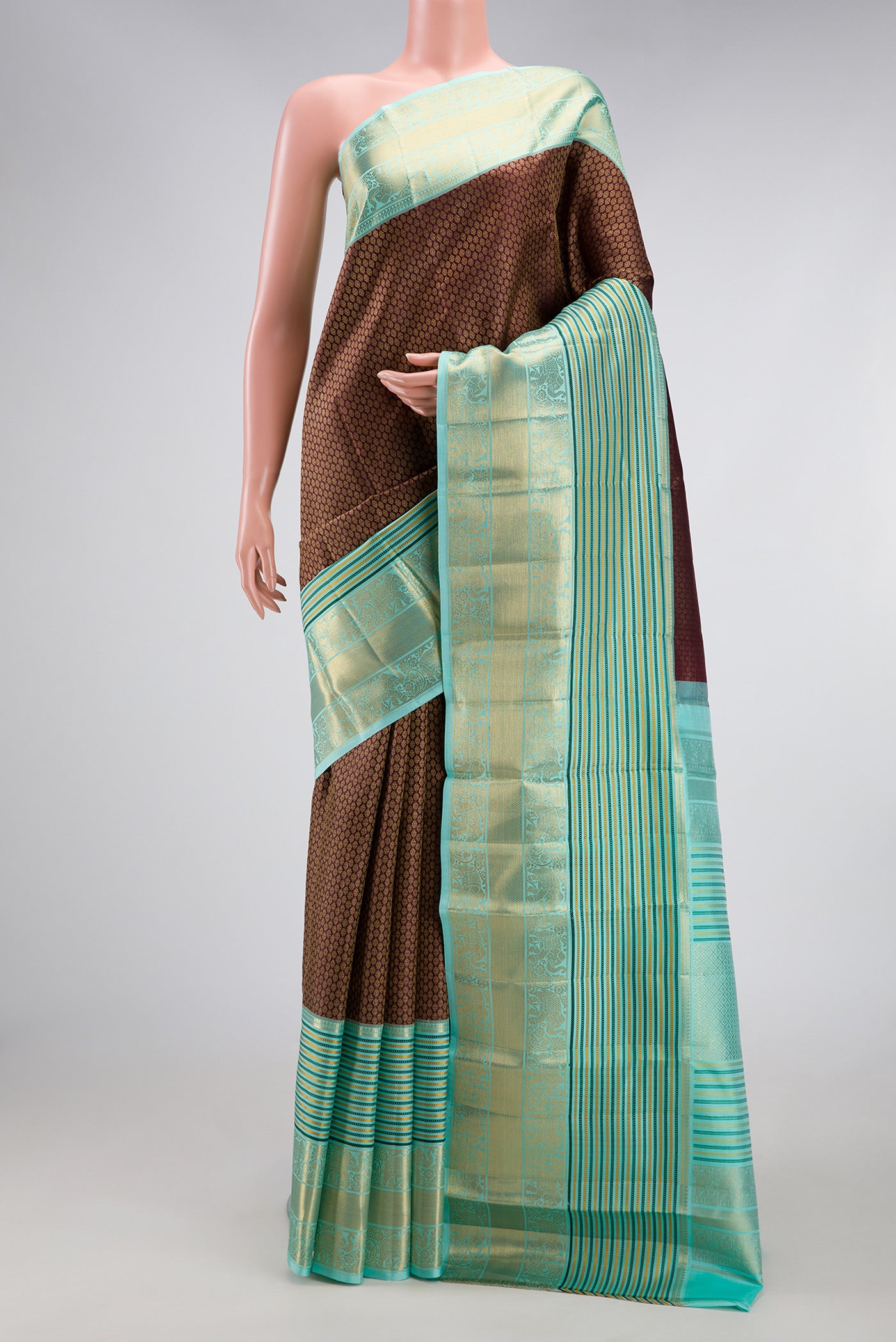 Coffee Brown Kanjivaram Silk Saree with Zari Brocade on the body and Zari Border.  displayed on a mannequin