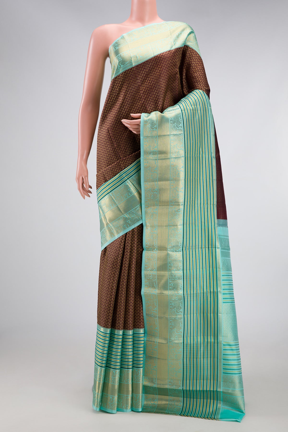 Coffee Brown Kanjivaram Silk Saree with Zari Brocade on the body and Zari Border.  displayed on a mannequin