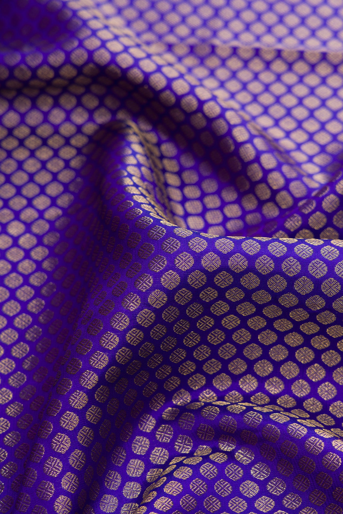 Close up of Royal Blue Dual Tone Kanjivaram Silk Saree with Zari Brocade on the body and Zari Border.  displaying folds