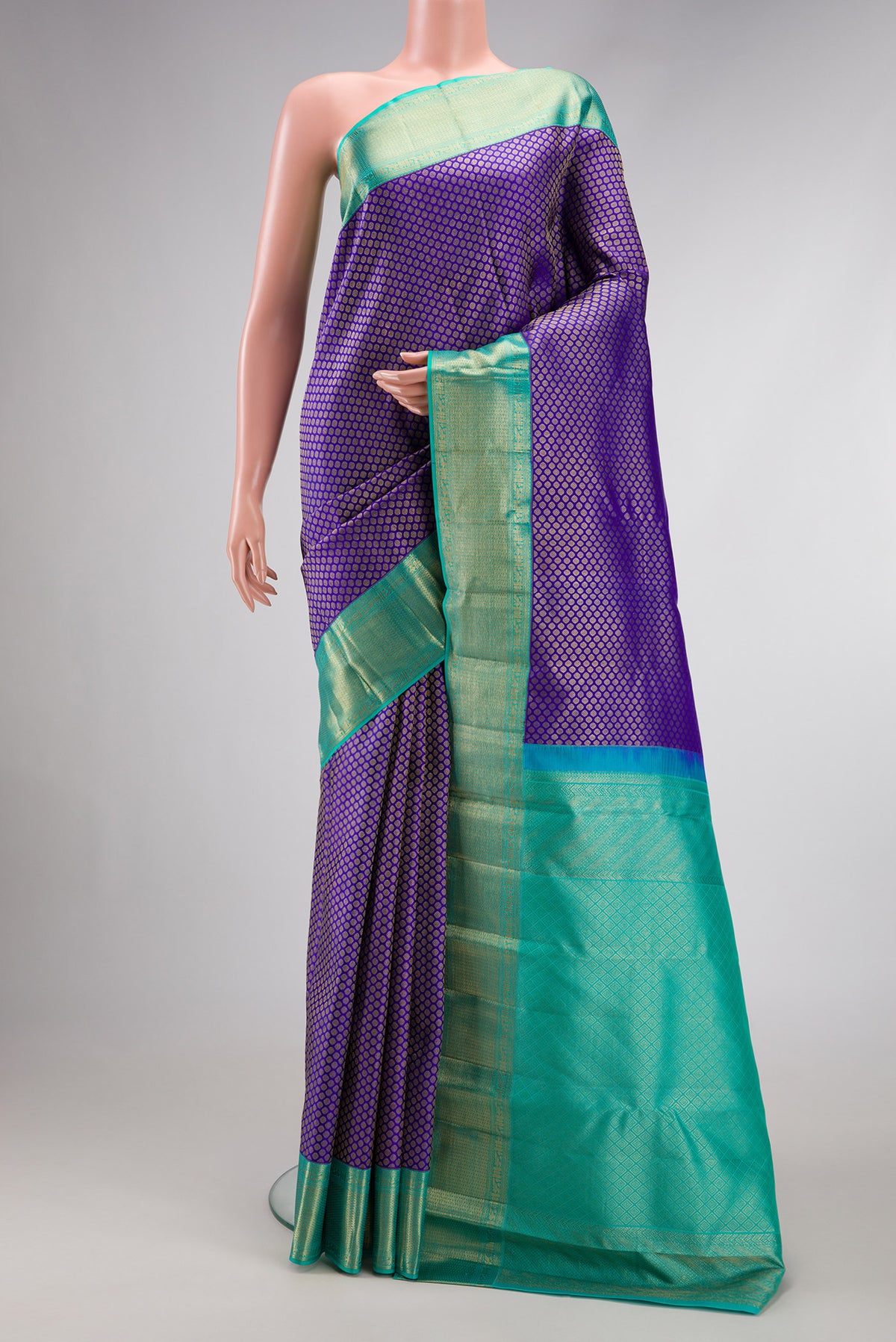 Royal Blue Dual Tone Kanjivaram Silk Saree with Zari Brocade on the body and Zari Border.  displayed on a mannequin
