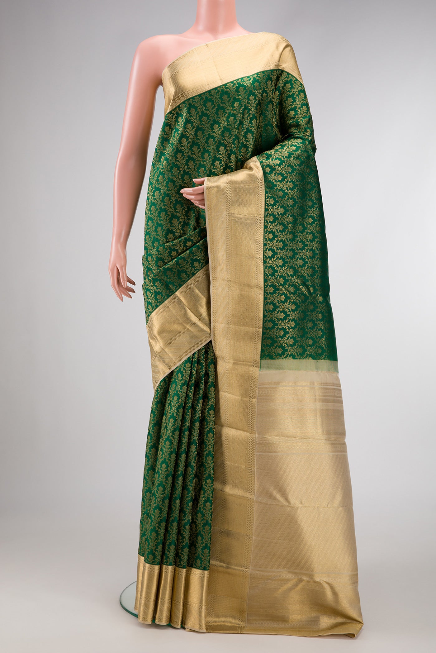 Green Dual Tone Kanjivaram Silk Saree with Zari Brocade on the body and Zari Border.  displayed on a mannequin