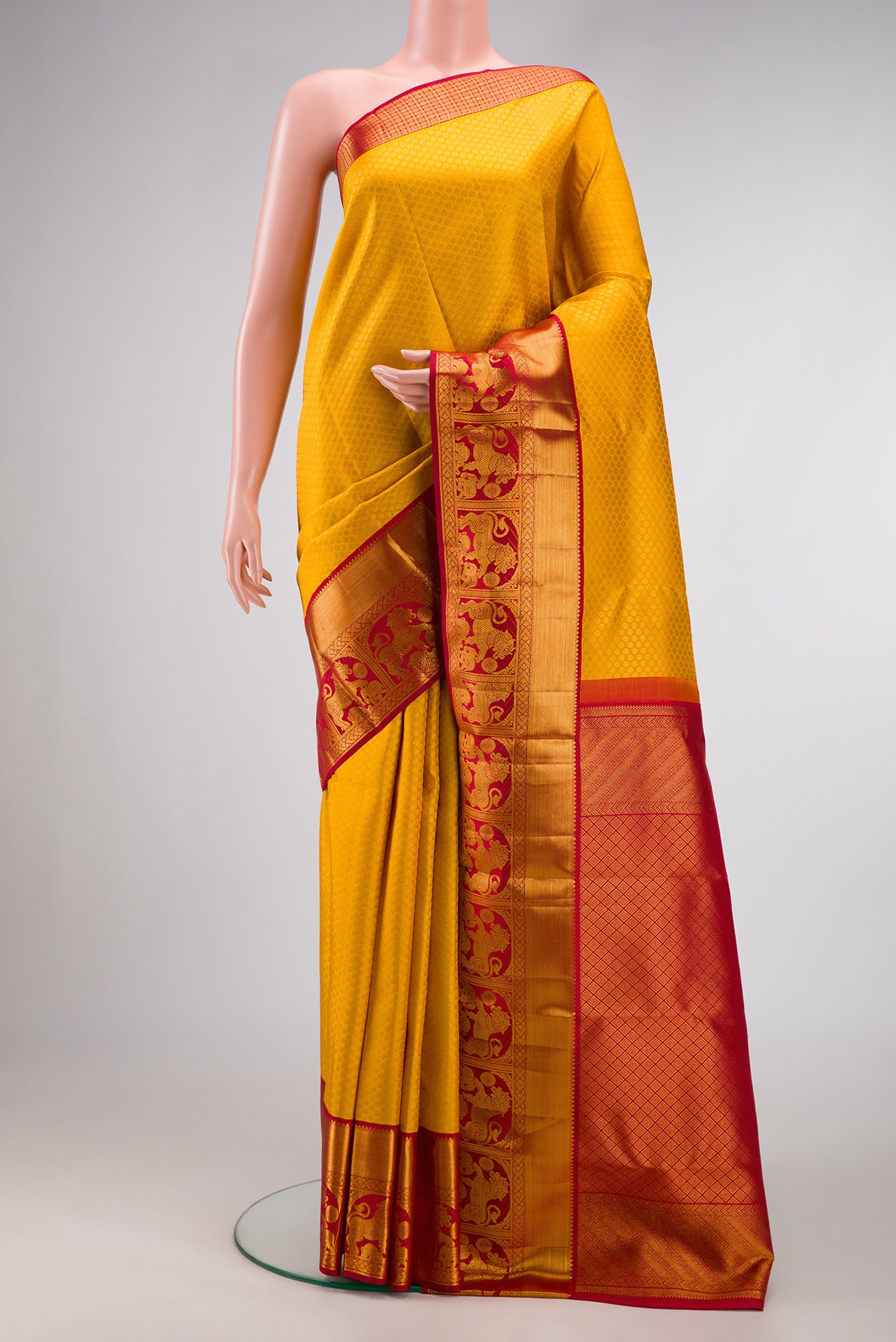 Mustard Dual Tone Kanjivaram Silk Saree with Zari Brocade on the body and Zari Border.  displayed on a mannequin