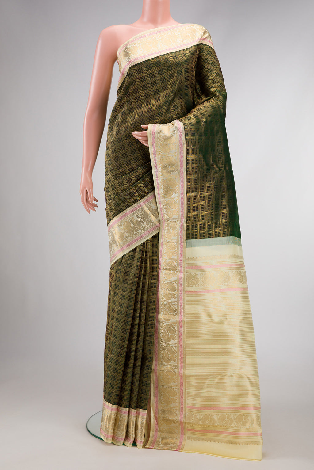 Green Dual Tone Kanjivaram Silk Saree with Zari Brocade on the body and Zari Border.  displayed on a mannequin