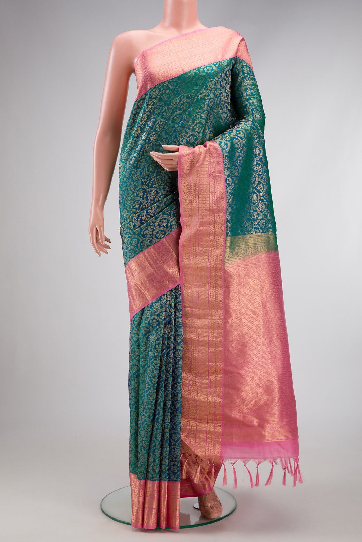 Peacock Blue Dual Tone Kanjivaram Silk Saree with Zari Brocade on the body and Zari Border.  displayed on a mannequin