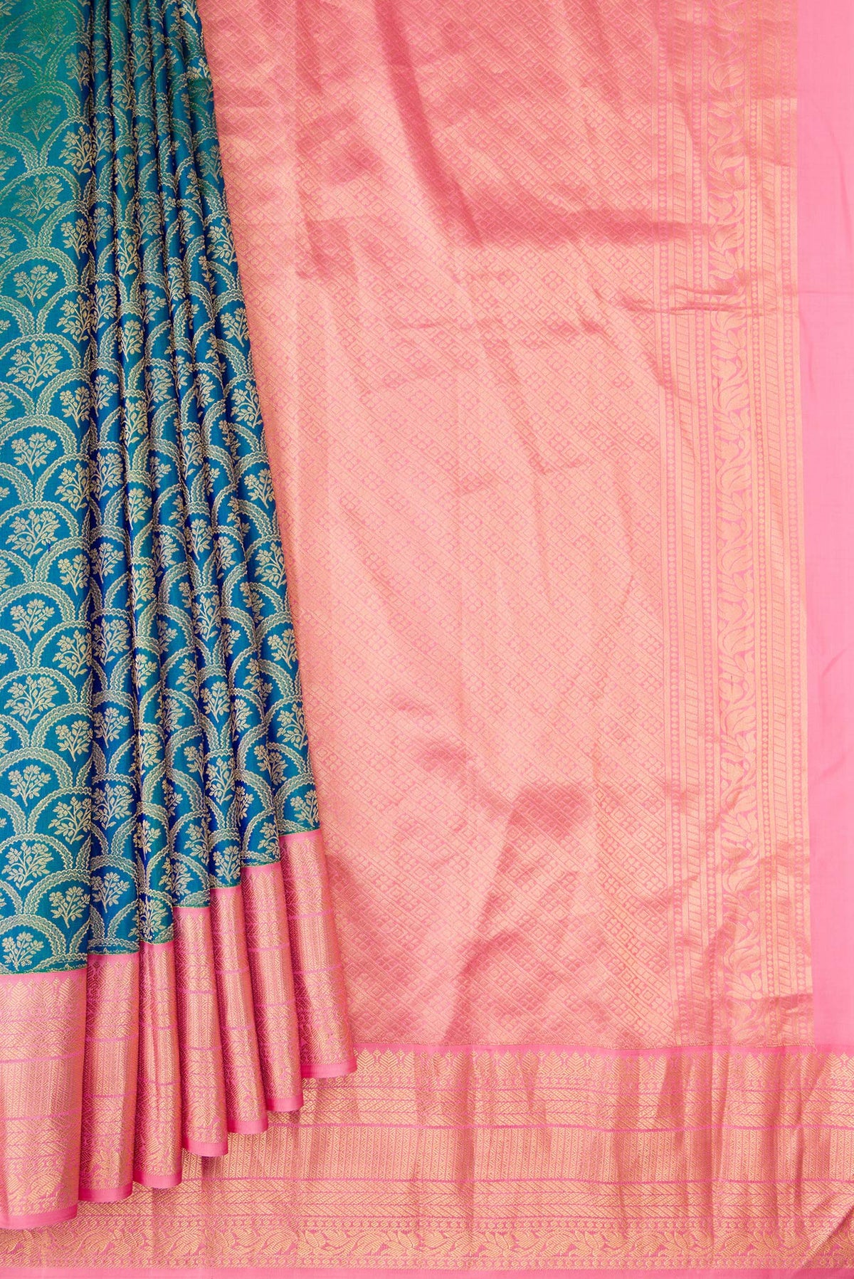 Pleats and pallu of Peacock Blue Dual Tone Kanjivaram Silk Saree with Zari Brocade on the body and Zari Border. 